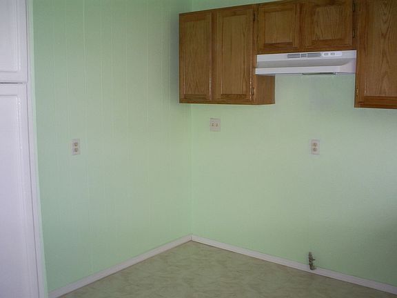 New sheet rock and bright paint everywhere (stove and fridge added after photo