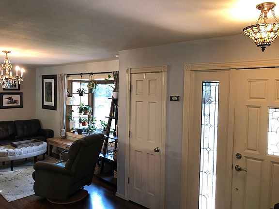 Entry and entry closet leading into main floor living room
