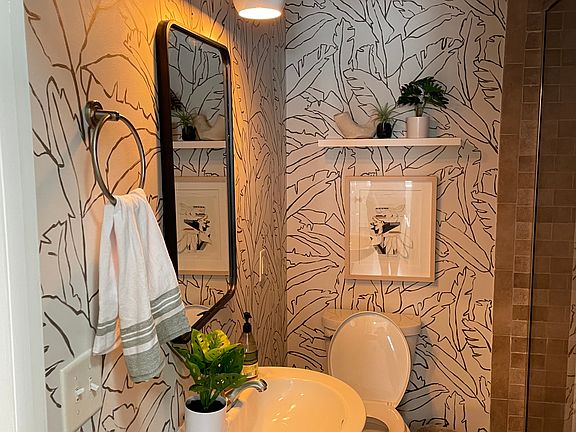 Hand painted custom bathroom mural. Large waterfall shower.