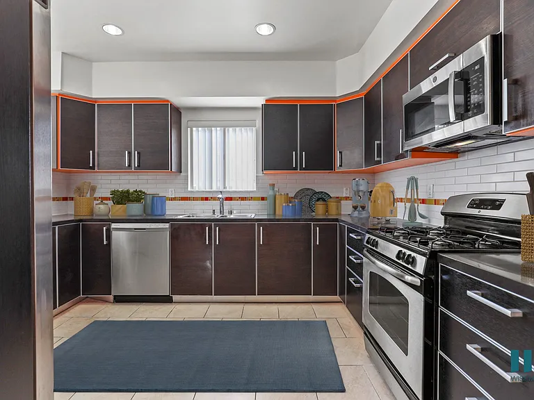 Large-Size Kitchen with Stainless-Steel Appliances and Ample Cabinet Storage