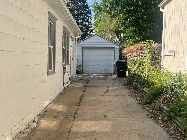 Driveway to a car garage parking for 3 vehicles