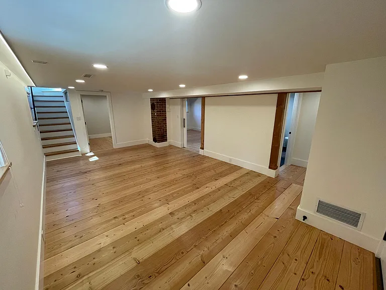 view from media room into the third bedroom and custom spa bathroom