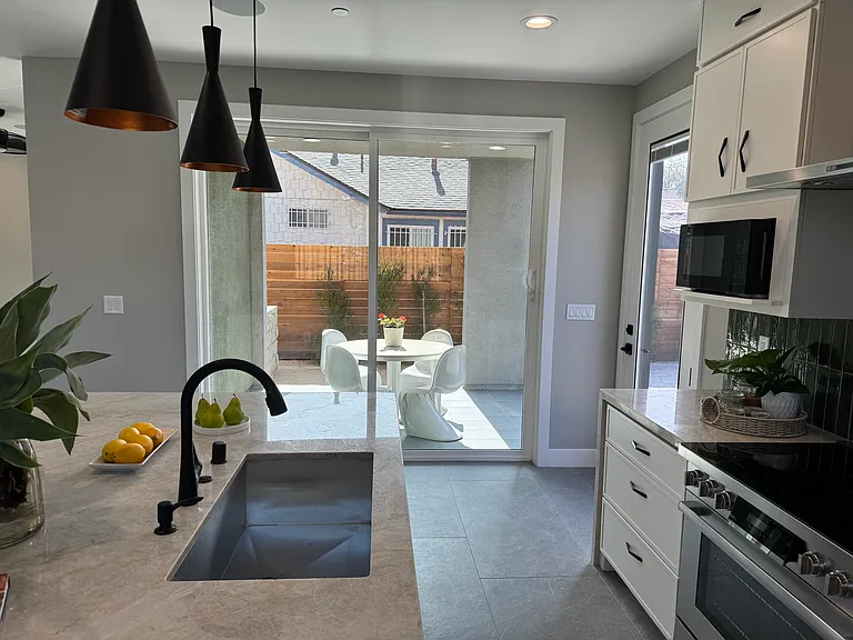 Indoor/outdoor eating area adjacent to kitchen
