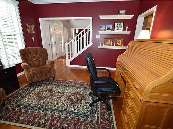 Formal living room could be den/study or cozy reading room.