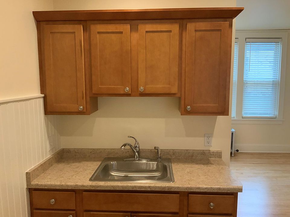 New kitchen counter, sink and cabinets view #2.