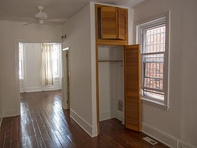 Closet that adjoins a fist floor powder room bathroom without shower.