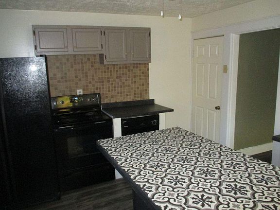 Kitchen: Island with Refrigerator, Stove and Dishwasher