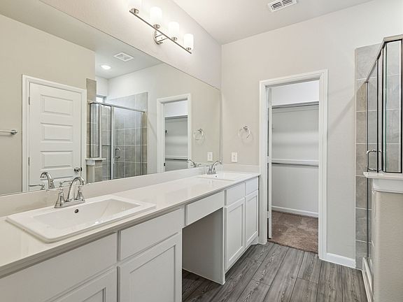 Primary Bathroom in the Pearl home plan by Trophy Signature Homes - REPRESENTATIVE PHOTO