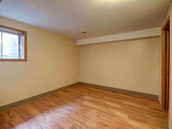 One of two downstairs bedrooms. Large egress window.