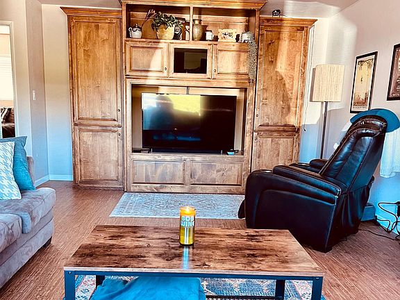 Living Room and Entertainment Center. Will hold up to a 65" TV. Tons of storage.