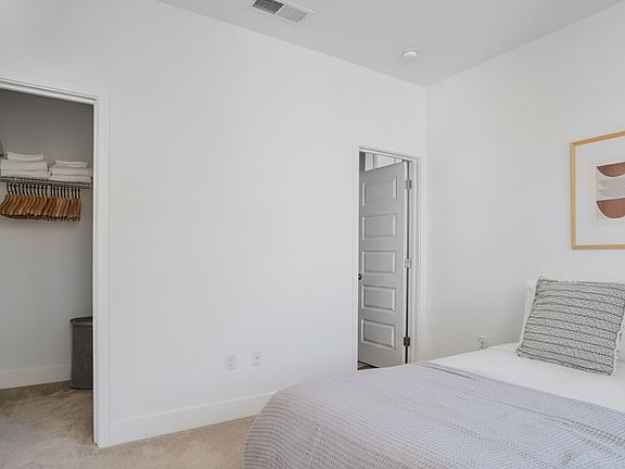 1st Floor Bed- Walk-in closet (Furniture shown for staging purpose only)