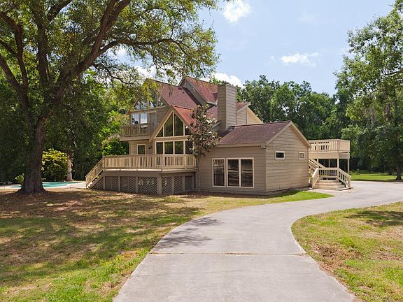 Very well cared for home sits on nearly 6 acres with barn and pool!