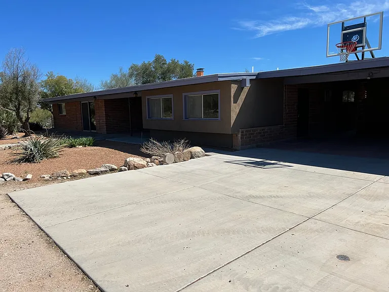 Concrete area in front of carport