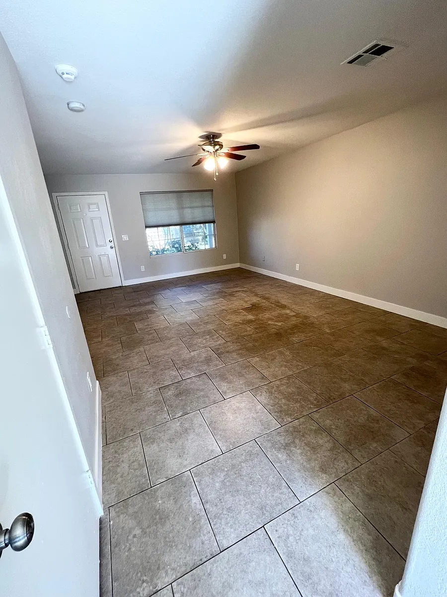 Main living space/view from kitchen - 10101 N 91st Ave #113