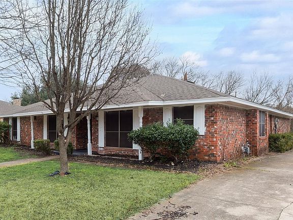Ranch-style home featuring a front lawn