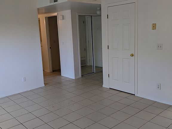 Livingroom view toward entrance and hall to bedrooms