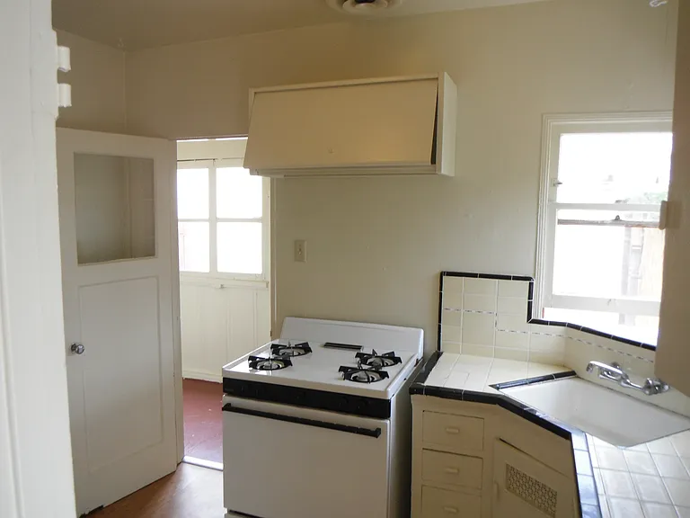 Kitchen showing door into service porch