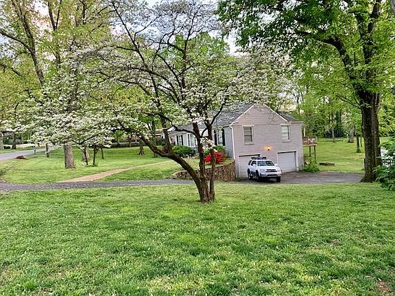 2 car garage and peek of back deck