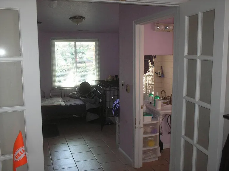 French doors to large bedroom and oversized shower.