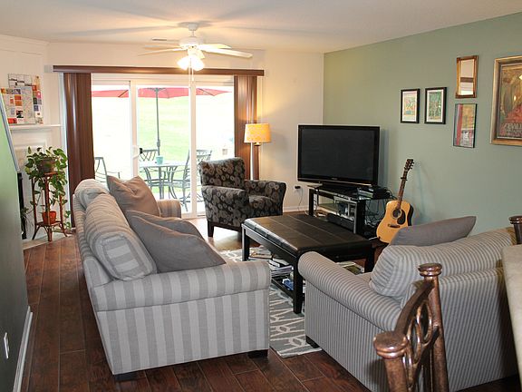 Laminate Hardwoods in Living Room Open to Patio / Deck