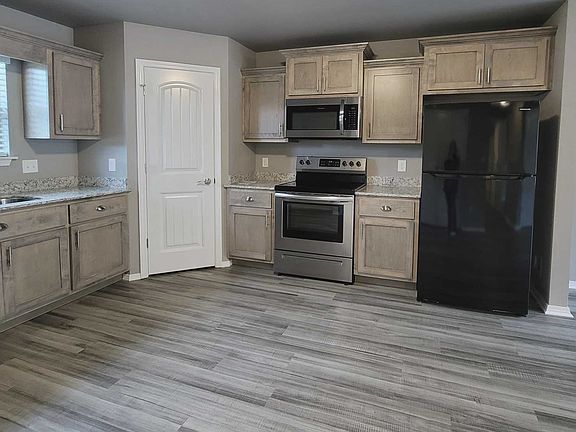 Modern kitchen with plenty of cabinets and large pantry