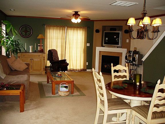 Beautiful Open Living Room With A Charming Gas Log Fireplace.