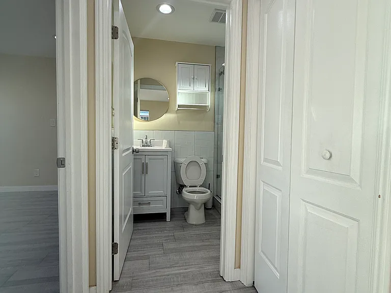 From the kitchen: Bathroom straight ahead, bedroom to the left, washer/ dryer behind doors to the right.
