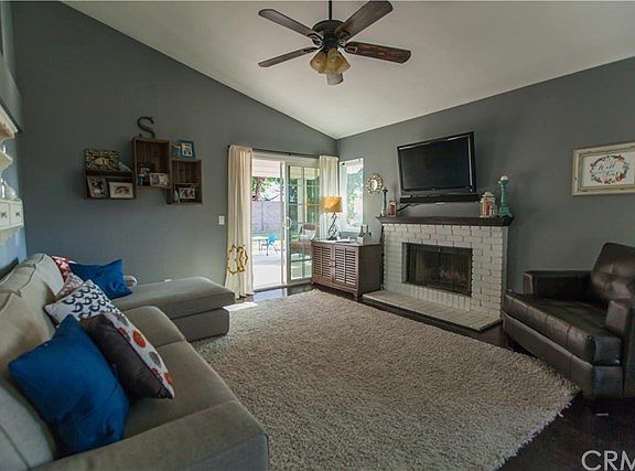 LIVING ROOM OPENS TO INVITING COVERED PATIO