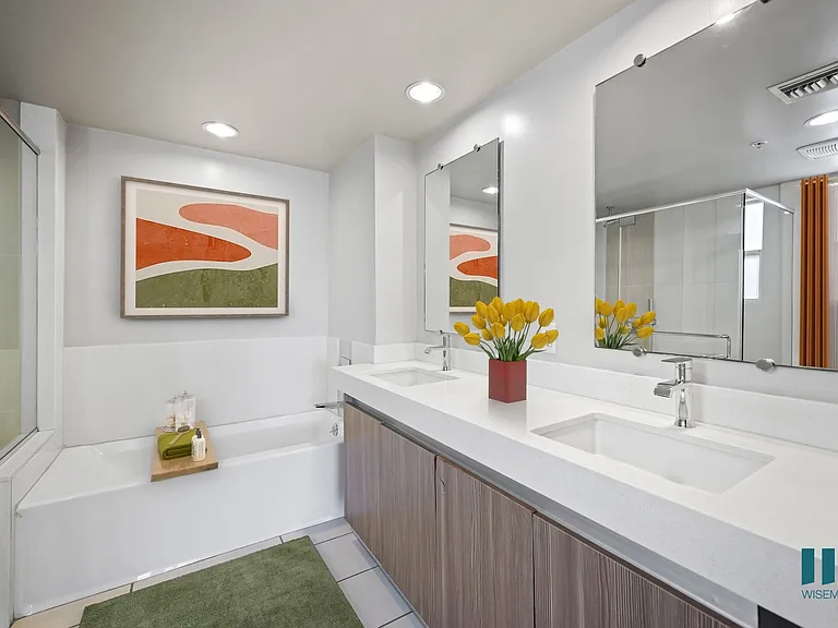 Primary Bathroom with a Walk-In Shower, Bathtub, and Double-Sink Vanity,