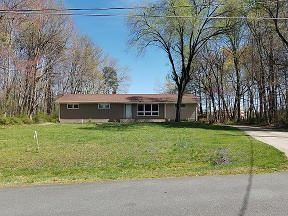 Large front yard with mature trees!