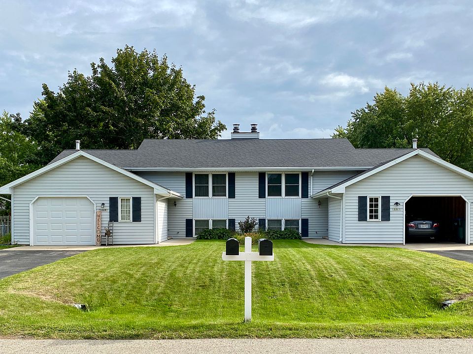 Front of the duplex. The 3311 unit is the one with the open garage door.