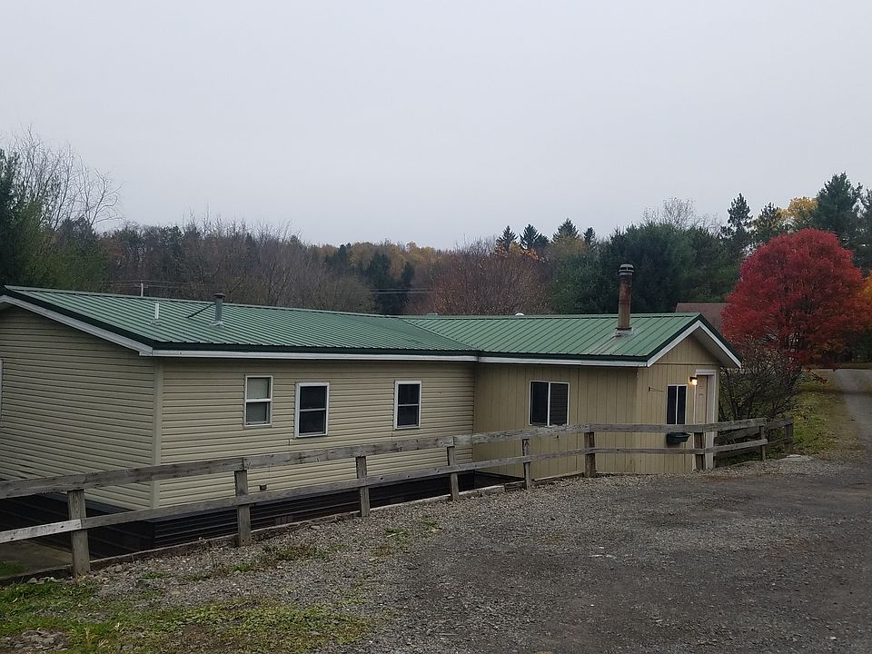 side of house and parking area