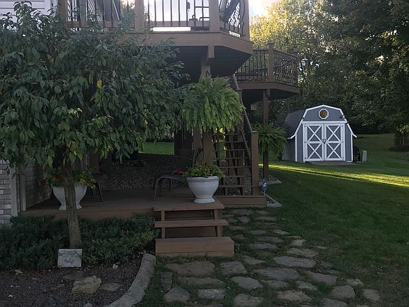 View of Deck(s) and Shed