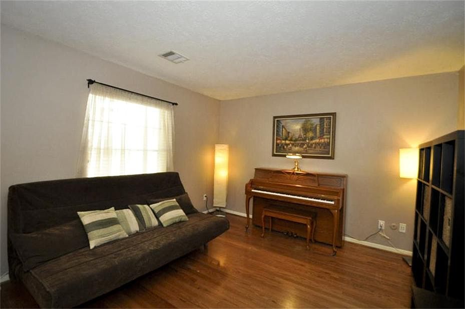  Formal Living Room is currently being used as a Music Room but can easily be utilized as a Study or even a 4th Bedroom