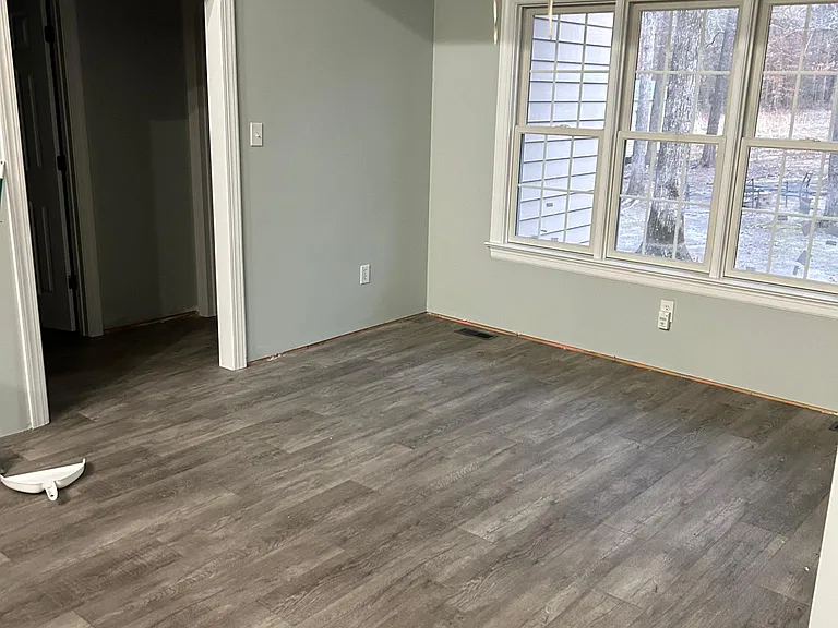 Dining room attached to kitchen with excellent natural lighting/beautiful view of back yard.