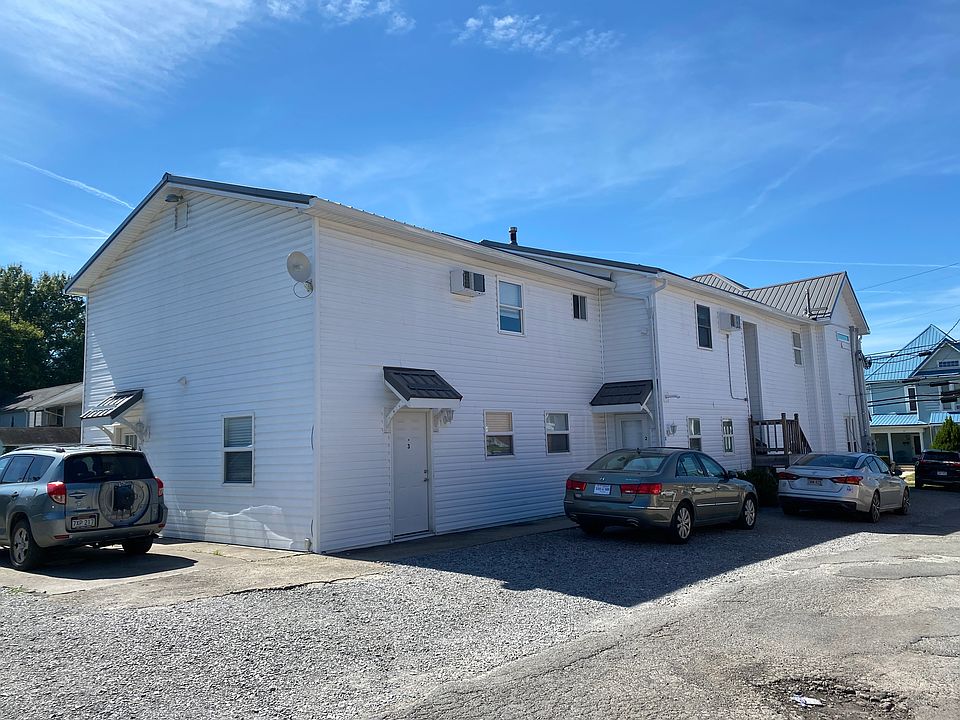 Unit is on the end, ground floor. Two entrances - one on the alley side, one on the parking lot side.