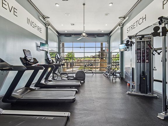 Large Fitness Center with Treadmills, Free Weights & Much More at Overlook at Stone Oak Park Apartments, San Antonio