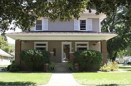 Front View of Home From Davenport Street : Large front porch with porch swing and sitting area