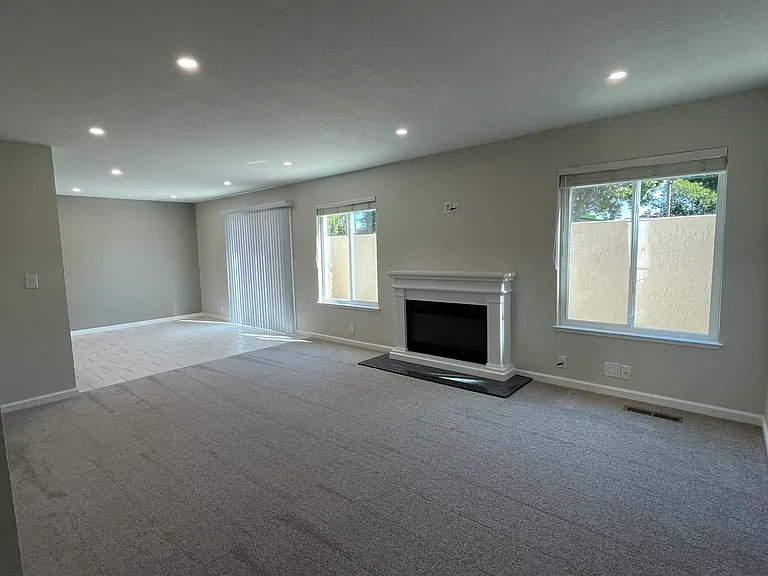 New carpets, windows, paint, and recessed lighting throughout