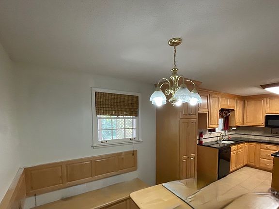 Kitchen with built in breakfast nook bench seat and table