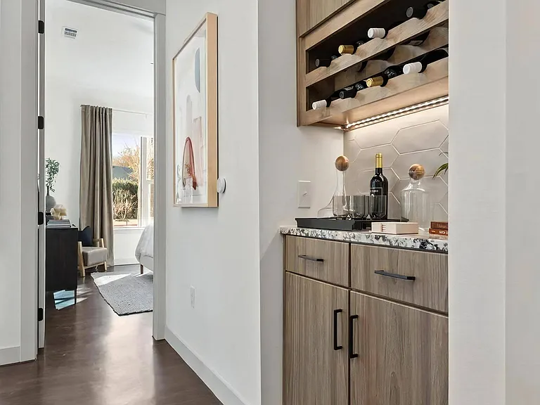 In-Unit Dry Bar with Granite Countertop and Wine Bottle Storage