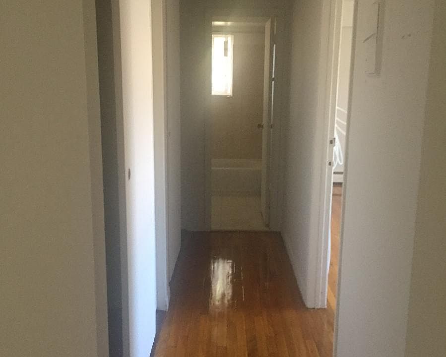 Hallway lined with tons of closets
