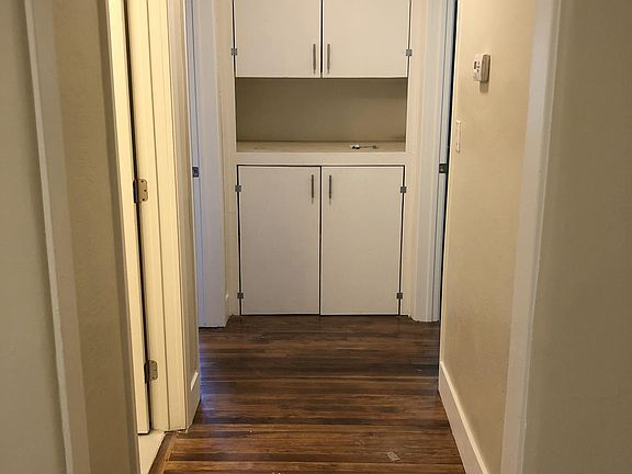 Hallway with cabinetry
