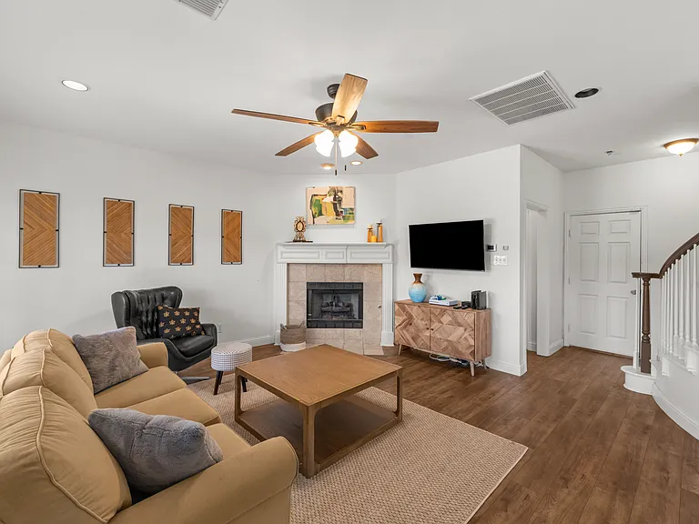 Warm, inviting room with soft seating and a wood-burning fireplace_perfect for unwinding.