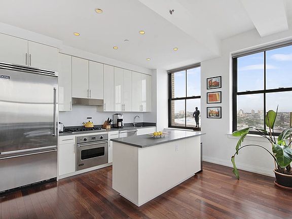 Island kitchen with Viking appliances, custom lacquer cabinetry and lava stone
