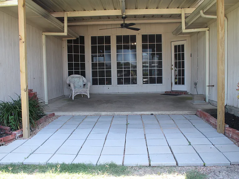 Adorable patio with fan and light on remote