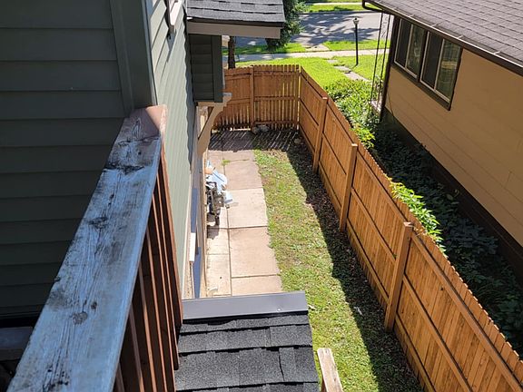 Side yard, door to laundry in basement.