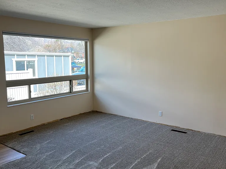 Bright large living room space with new light filtering cellular shades.