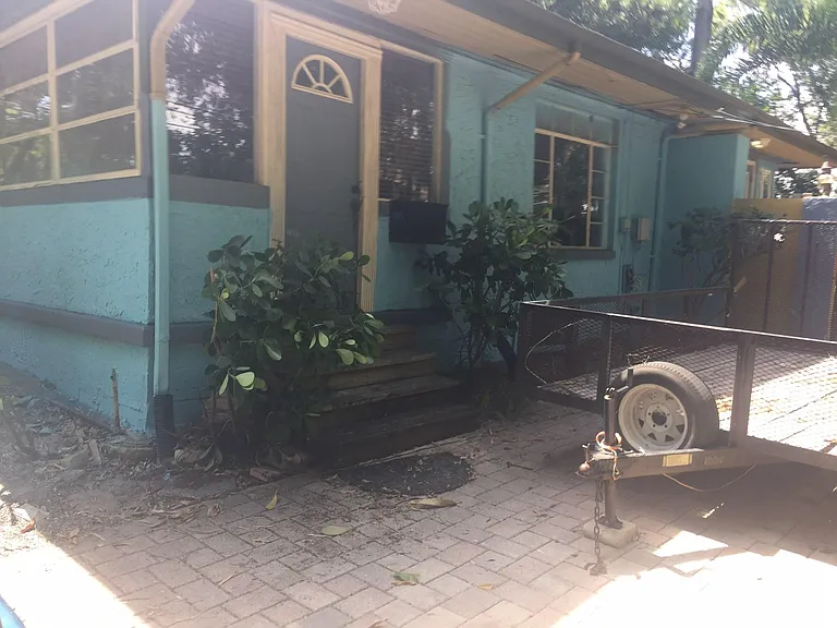 Well maintained home and mature landscaping with large fenced and wood gate entrance Payer driveway