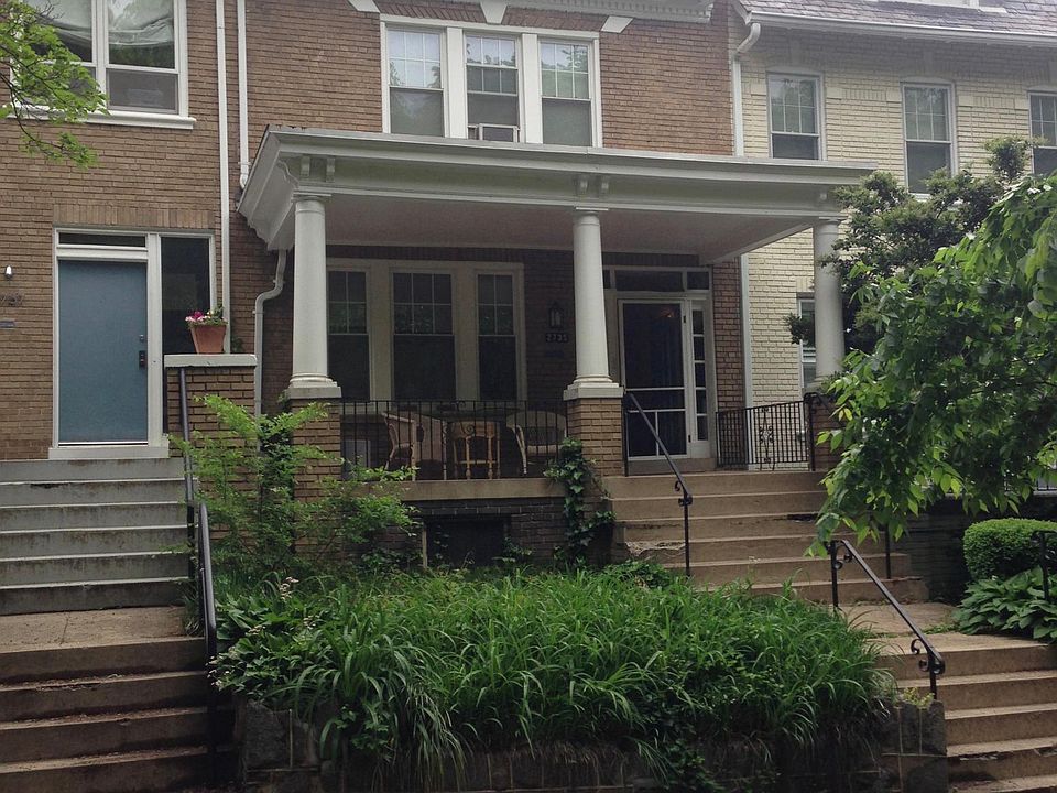 Front of Townhouse with large covered porch.